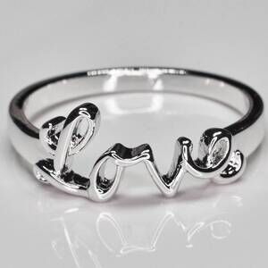 NEW FAIRE "love" rhodium plated ring in silver